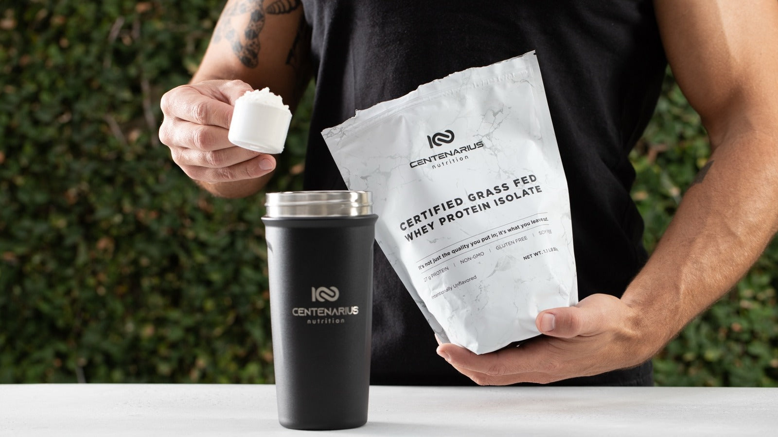 Clean grass-fed whey protein isolate with scoop and shaker by Centenarius Nutrition