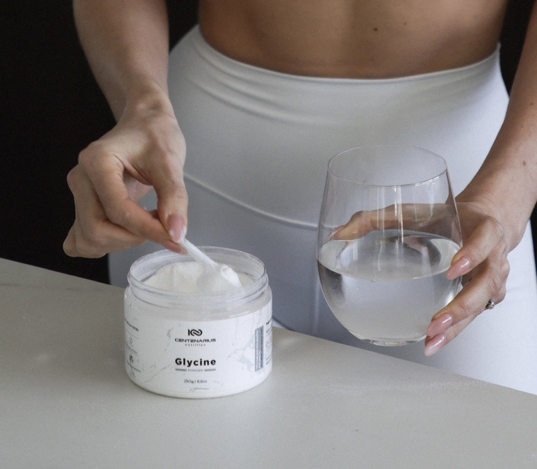 Woman preparing glycine powder supplement for sleep, gut health and longevity support